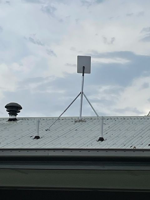 Starlink Satellite Dish on a Grassy Lawn — Apex Antenna Solutions Pty Ltd in Whitsundays, QLD