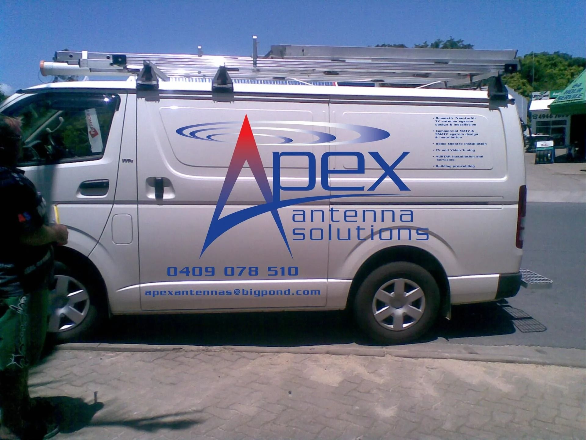 White Van With Apex Antenna Solutions Logo, Parked on a Street — Apex Antenna Solutions Pty Ltd in Bloomsbury, QLD
