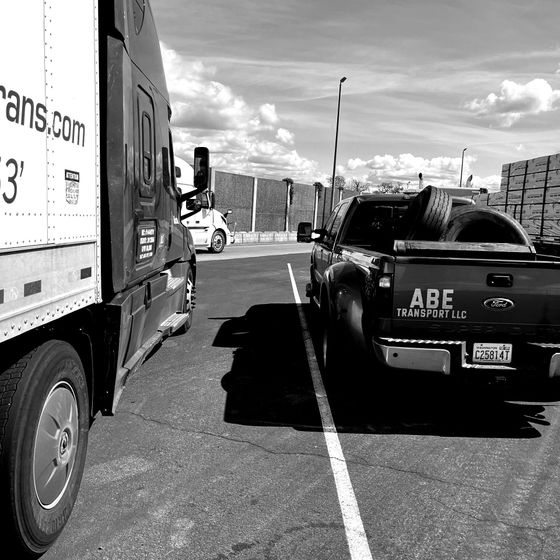 A black and white photo of a truck that says abe on the back