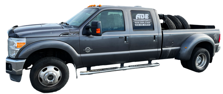 A gray truck with tires on the back is on a white background.