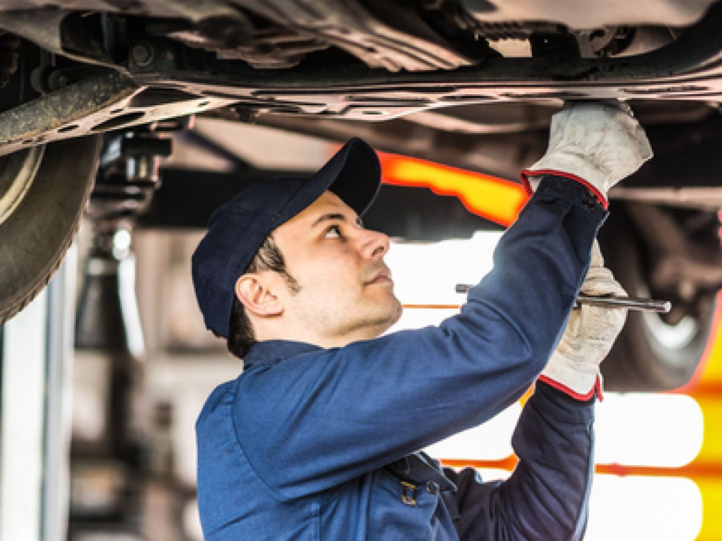 Auto mechanic work on car engine