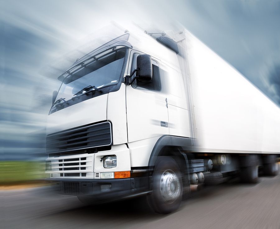 White truck at speed driveway