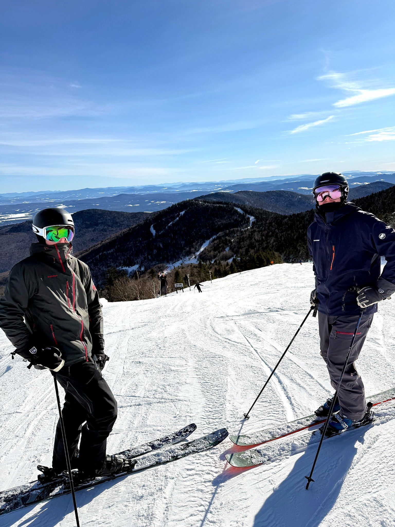 Skiers taking in the mountain view at Burke Mountain, 8 minutes from the Wildflower Inn