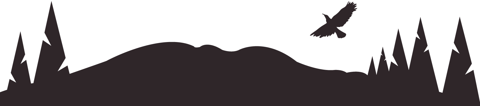 Silhouette of trees and hills with a bird flying overhead at dusk