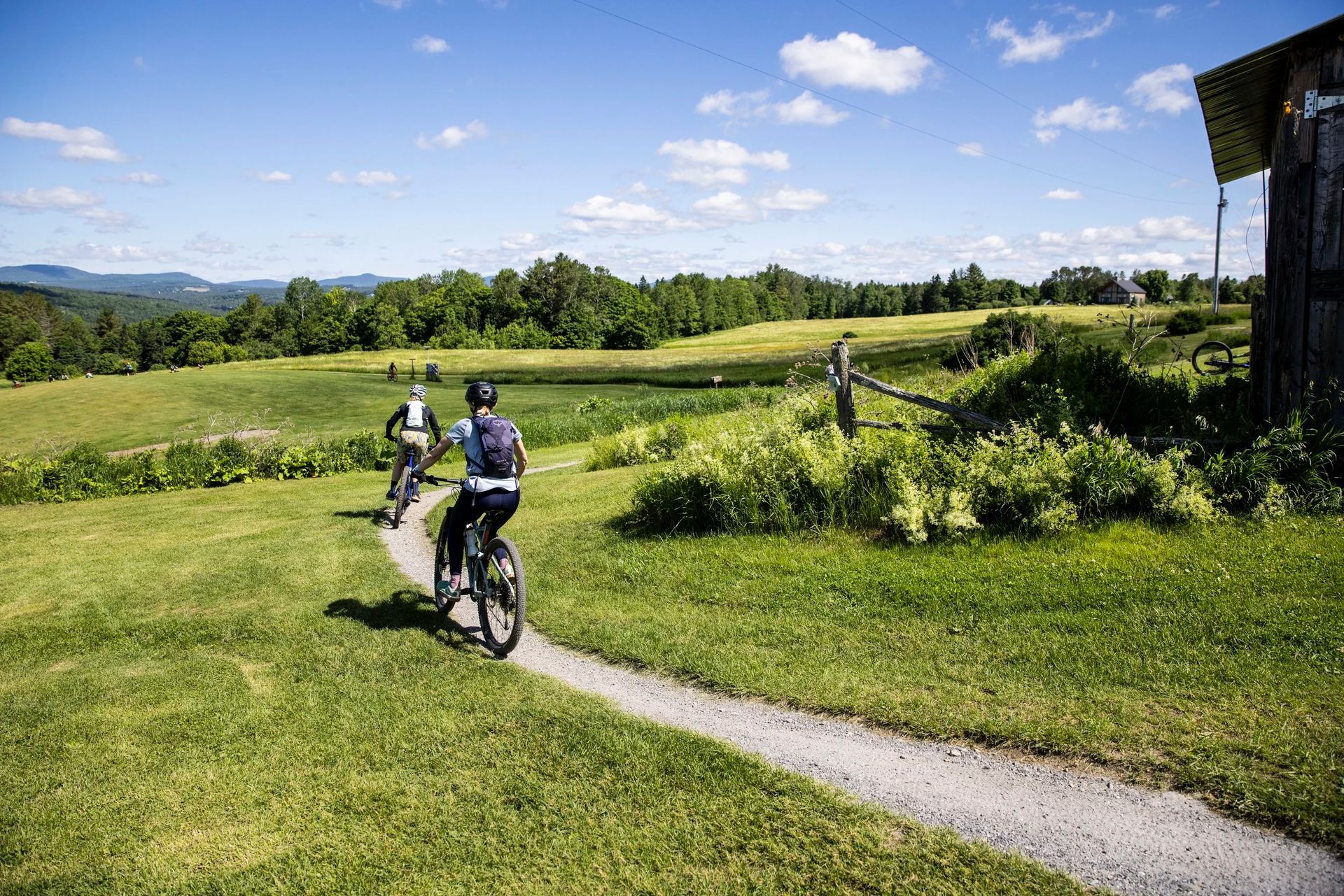 Mountain bikers riding Kingdom Trails on The Wildflower Inn property in East Burke, Vermont