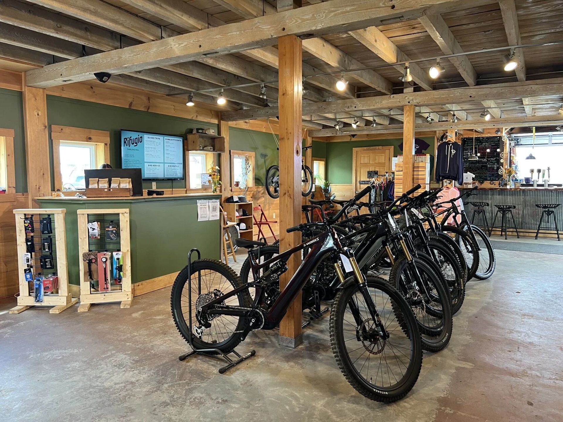A bike shop on site with rentals (including e-bikes), repairs, and guided rides, plus secure bike storage and a wash station