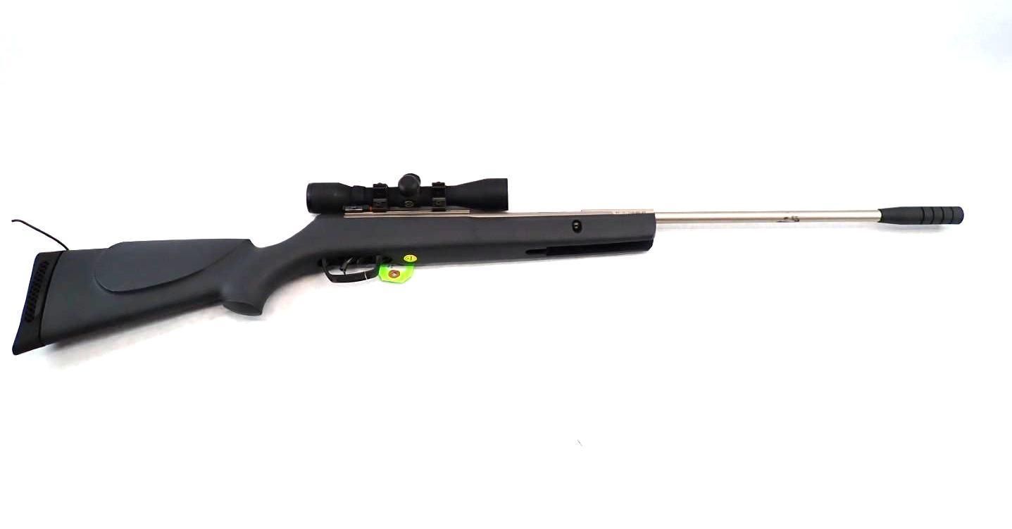 Black rifle with scope and long silver barrel on a white background