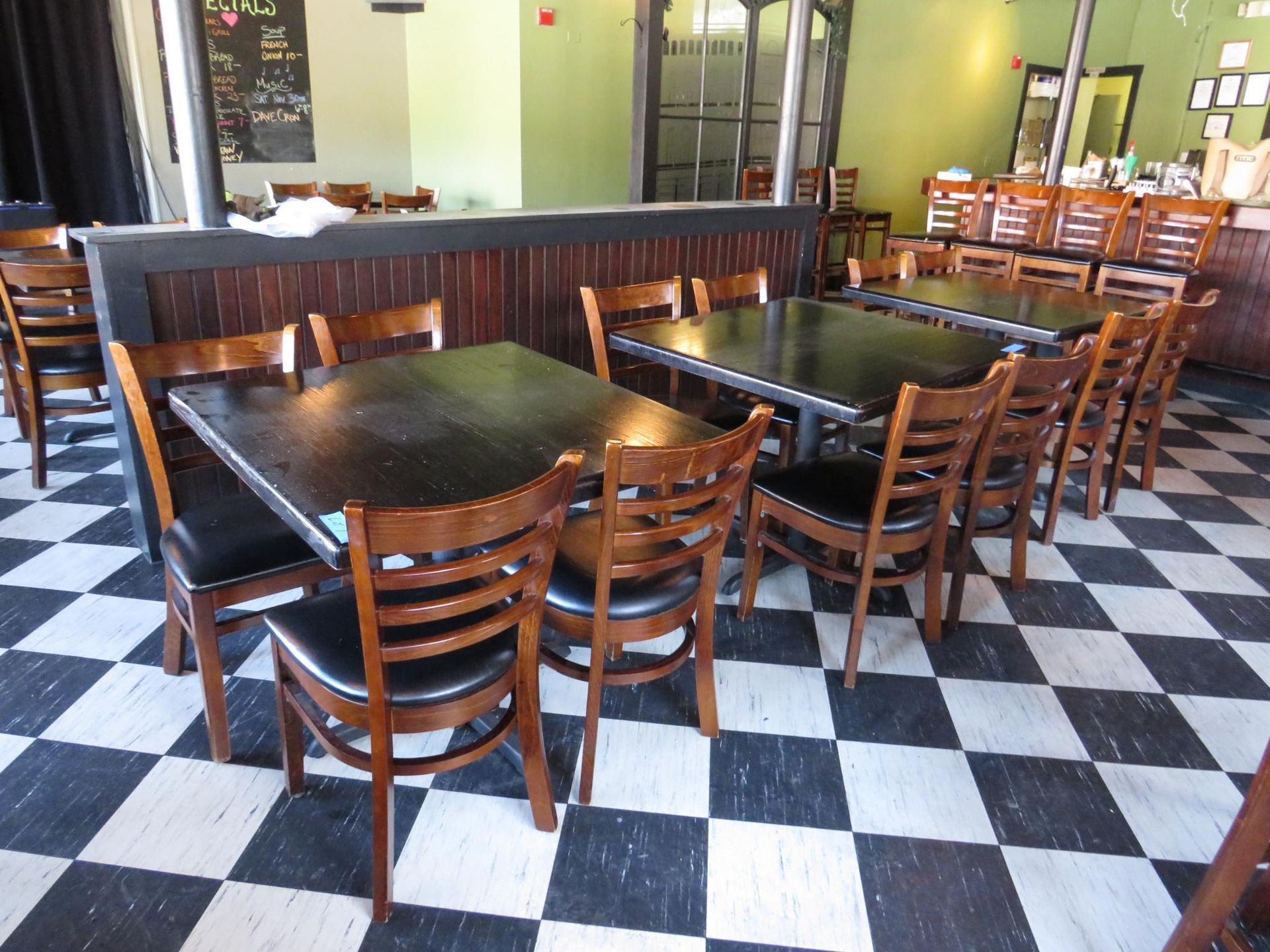 Restaurant tables with chairs.