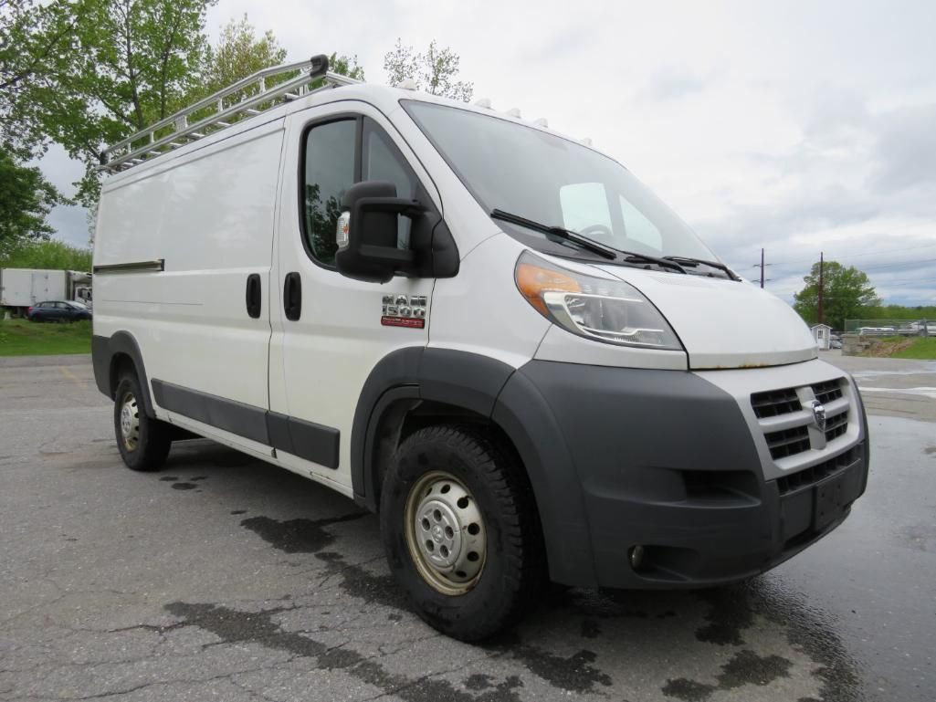 White Dodge Ram ProMaster cargo van with roof rack, parked outdoors.