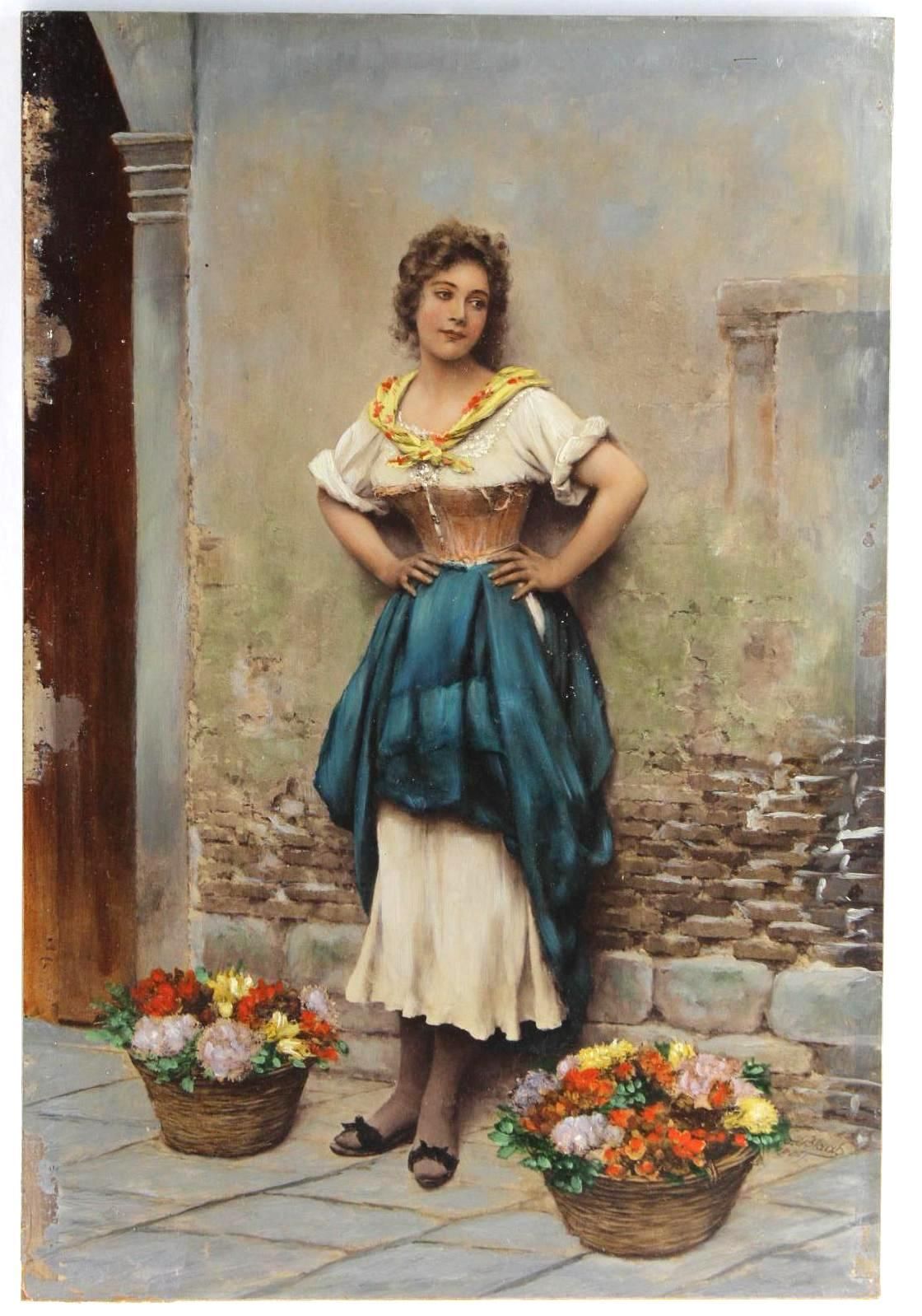 Woman in traditional dress poses by a brick wall with flower baskets on a cobblestone floor.
