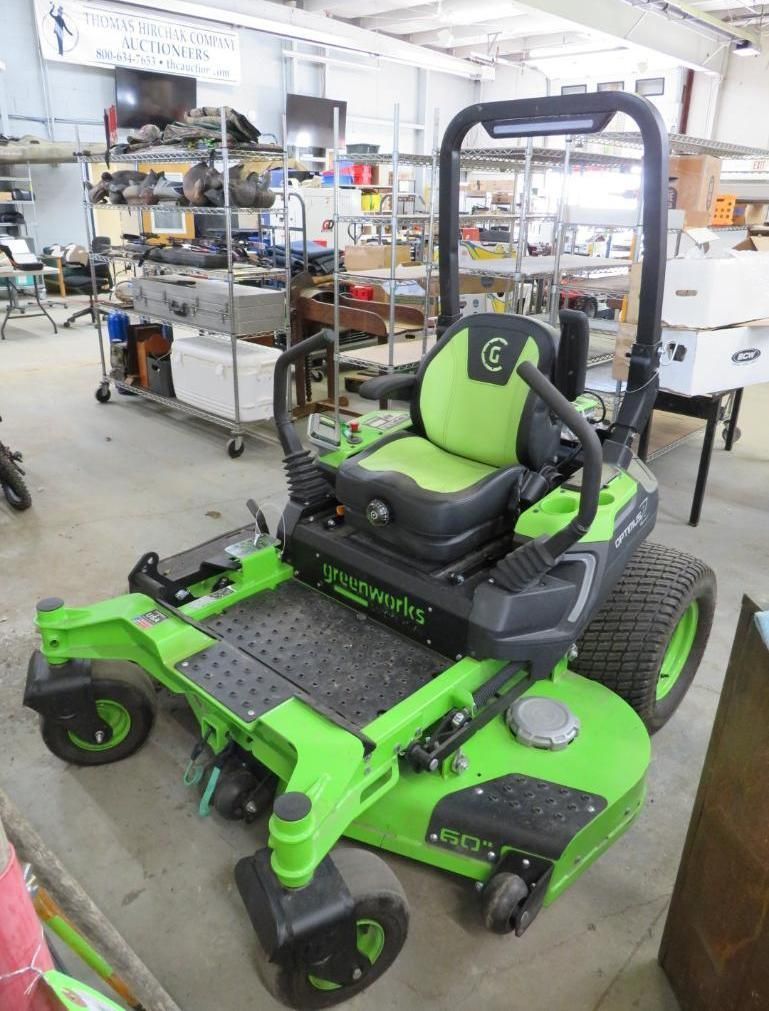 Green and black zero-turn lawn mower.