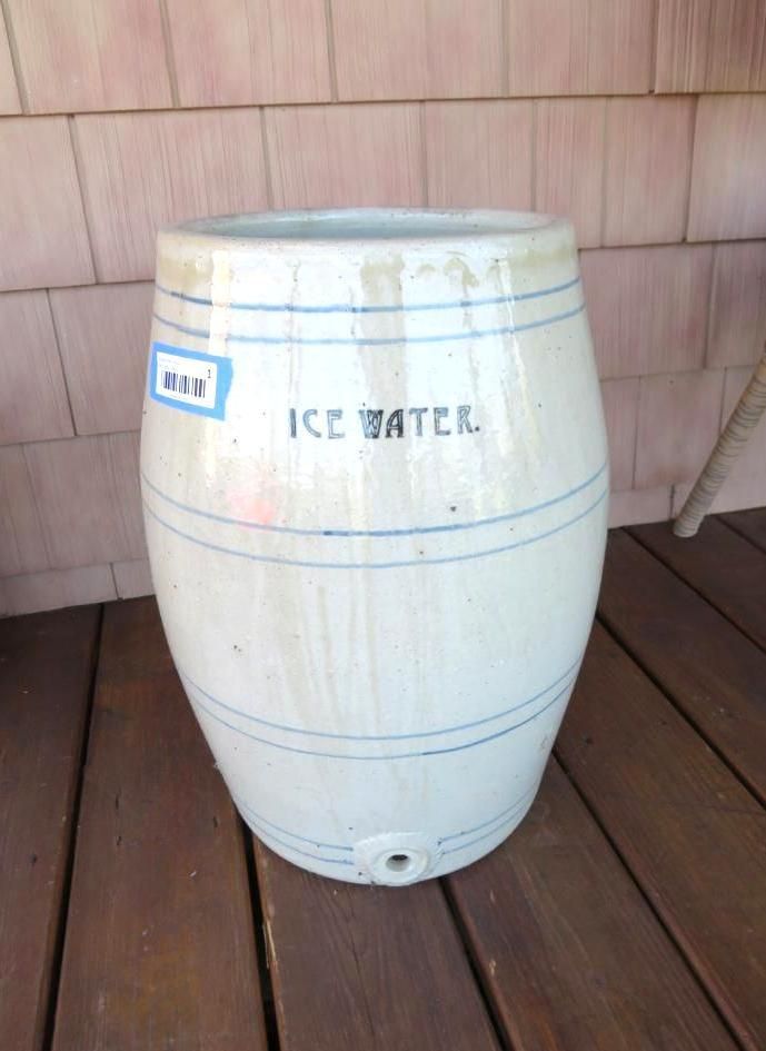 Large, white ceramic ice water crock with blue stripes and text. Spigot at the bottom.