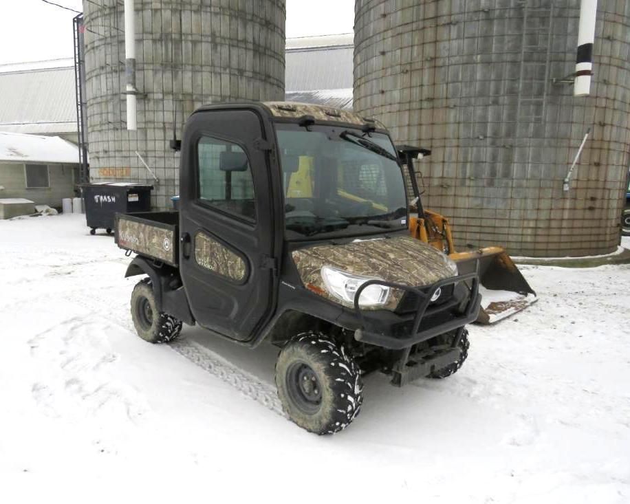 Black and camo utility vehicle with snow tires.