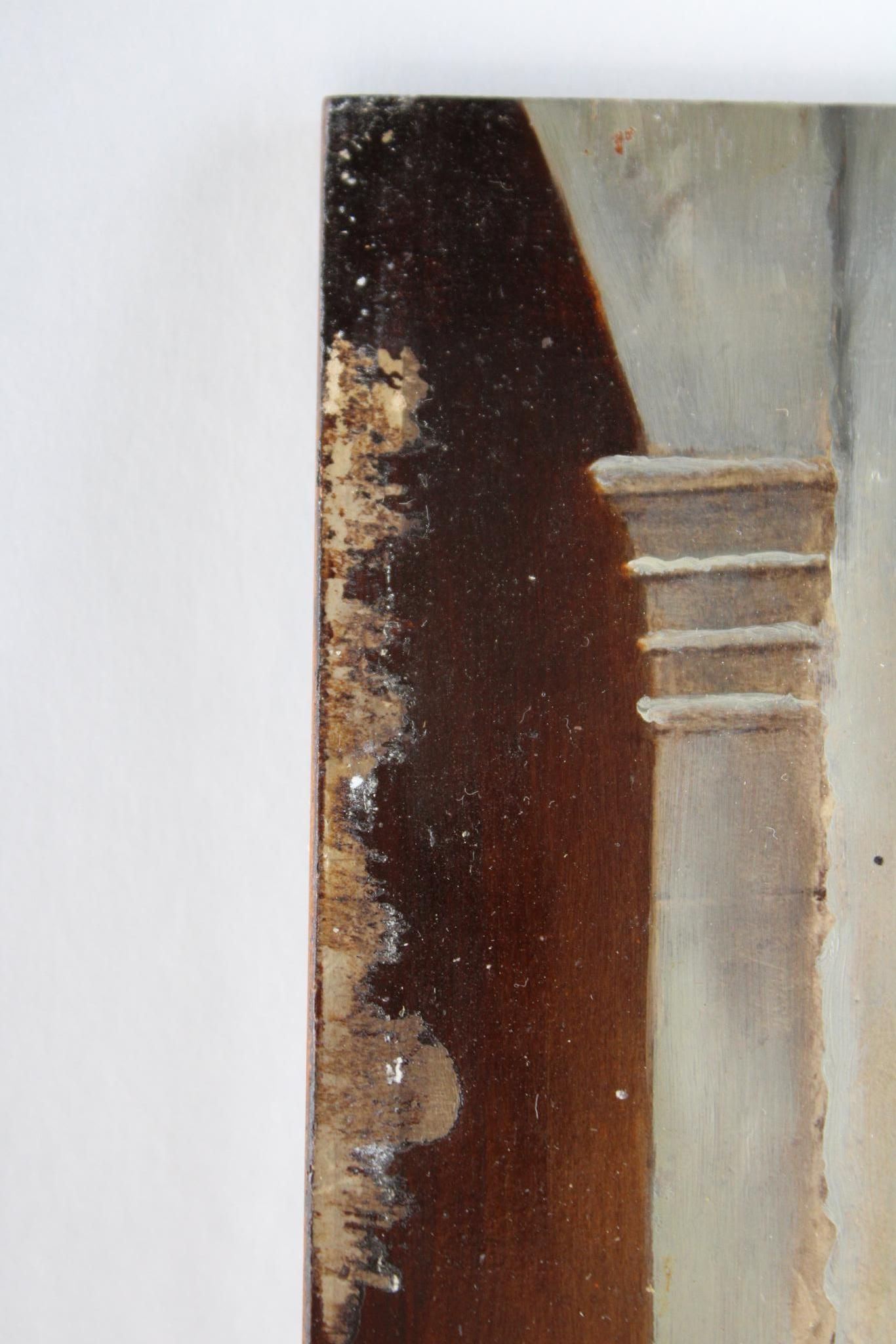 Close-up of a painting's edge showing detailed architectural column fragment with dark, distressed, and peeling paint.
