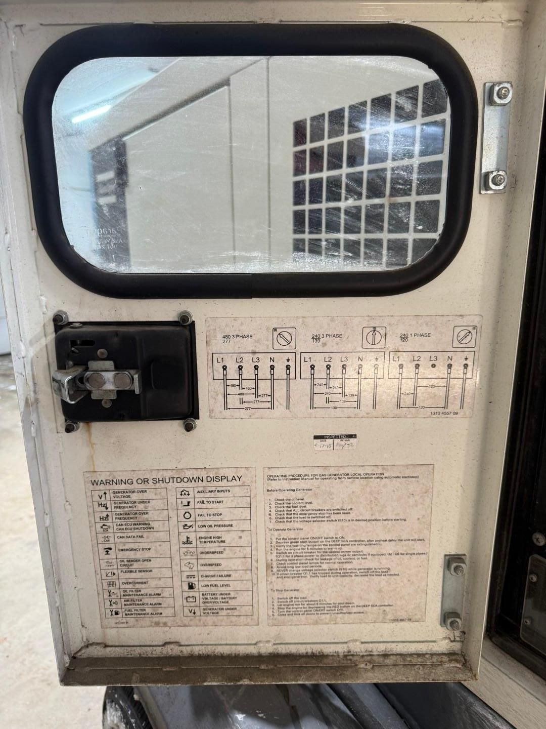 White equipment door with window, diagrams, and instructions.