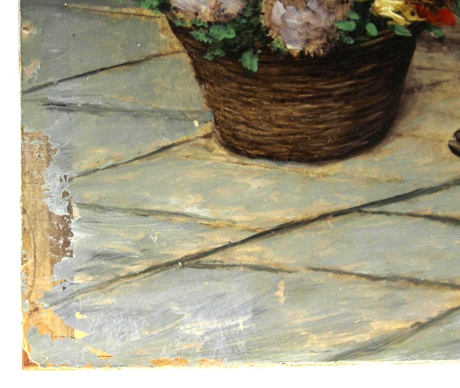 Wicker basket of flowers on tiled surface, chipped paint along the edge.