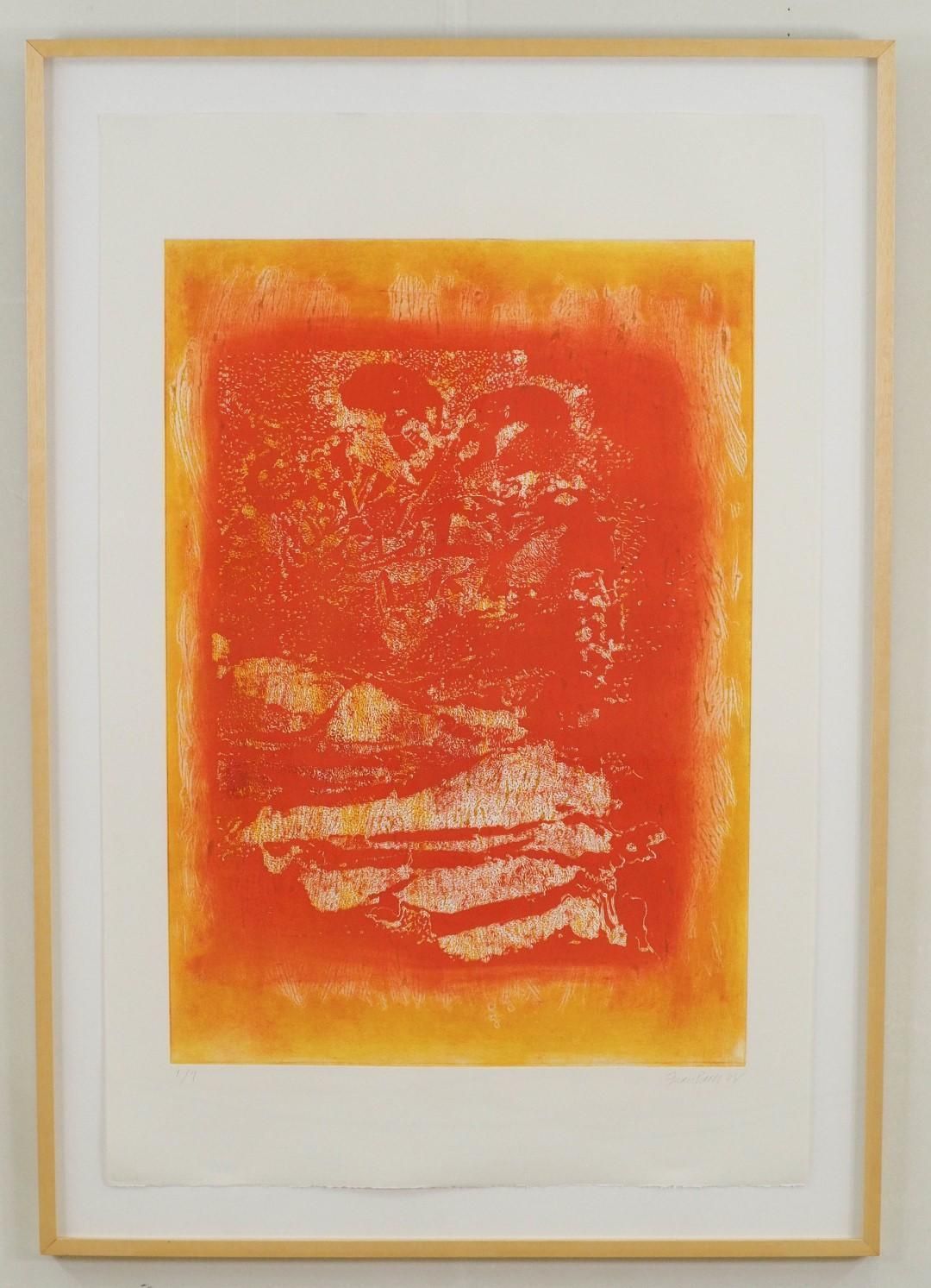 Orange and yellow abstract print in a wooden frame.