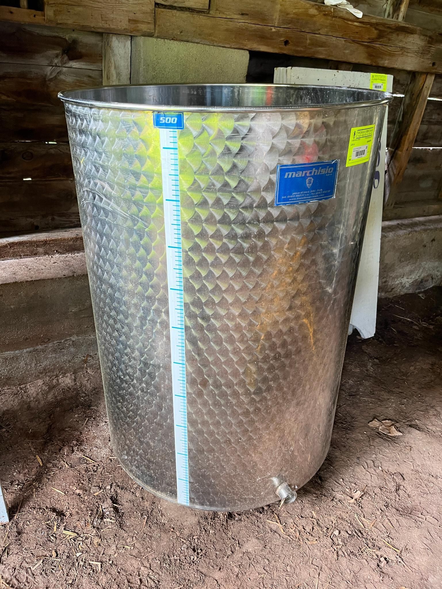 Stainless steel tank with a level indicator.