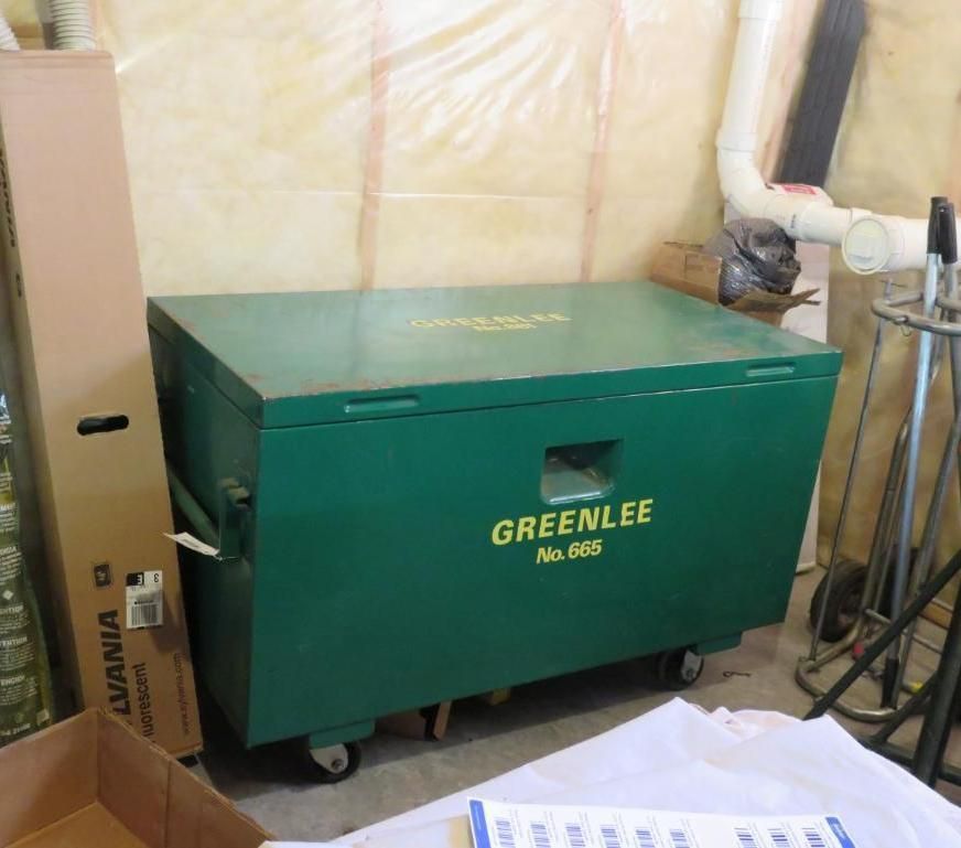 Green metal tool chest on wheels, with 
