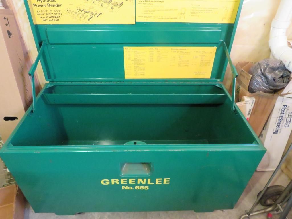 Green metal Greenlee tool chest, open.