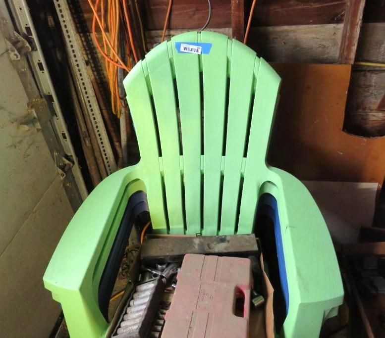 Green plastic Adirondack chairs.
