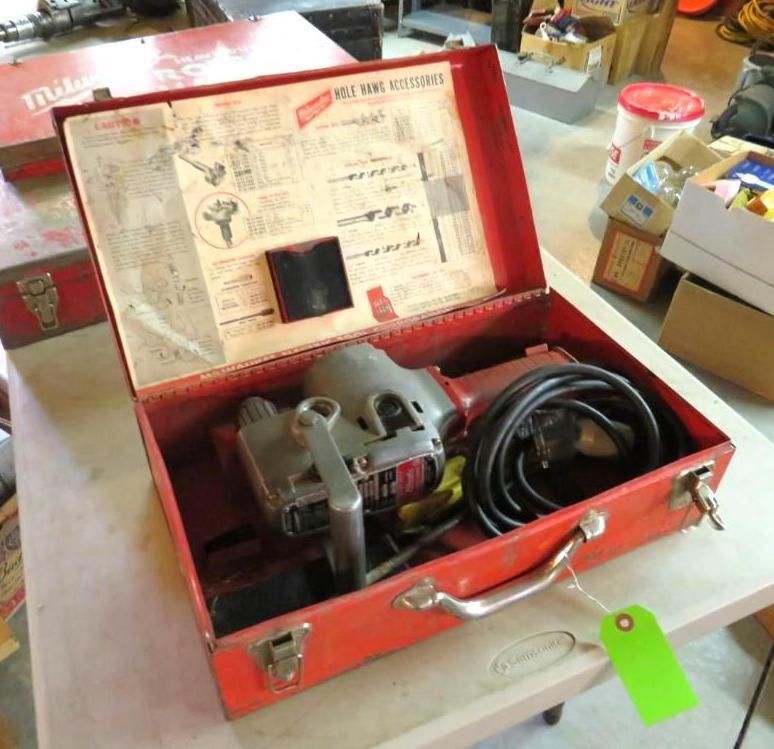 Red Milwaukee Sawzall in its original metal case.