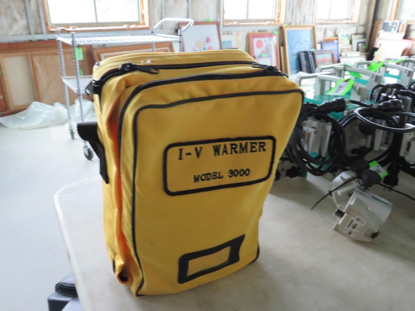 Yellow I-V Warmer Model 3000 bag on a table.