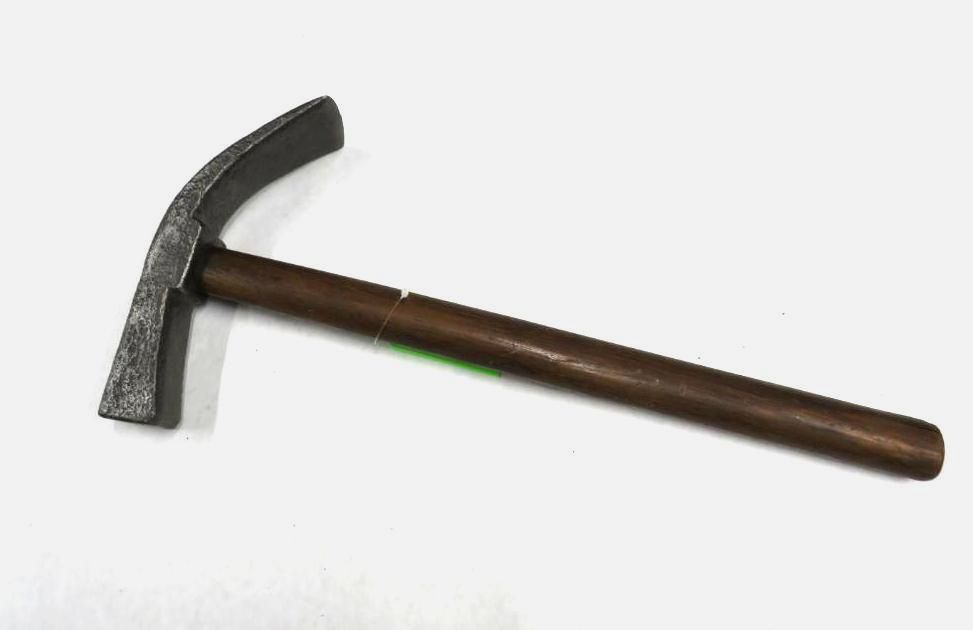 Geological hammer with curved head and wooden handle, on white background.