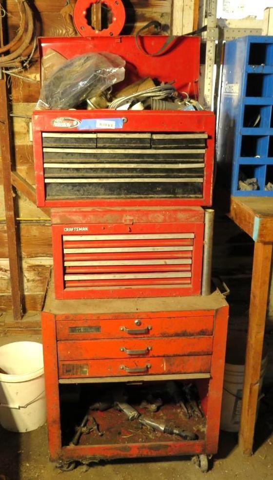 Red tool chest stacked with drawers, on wheels.