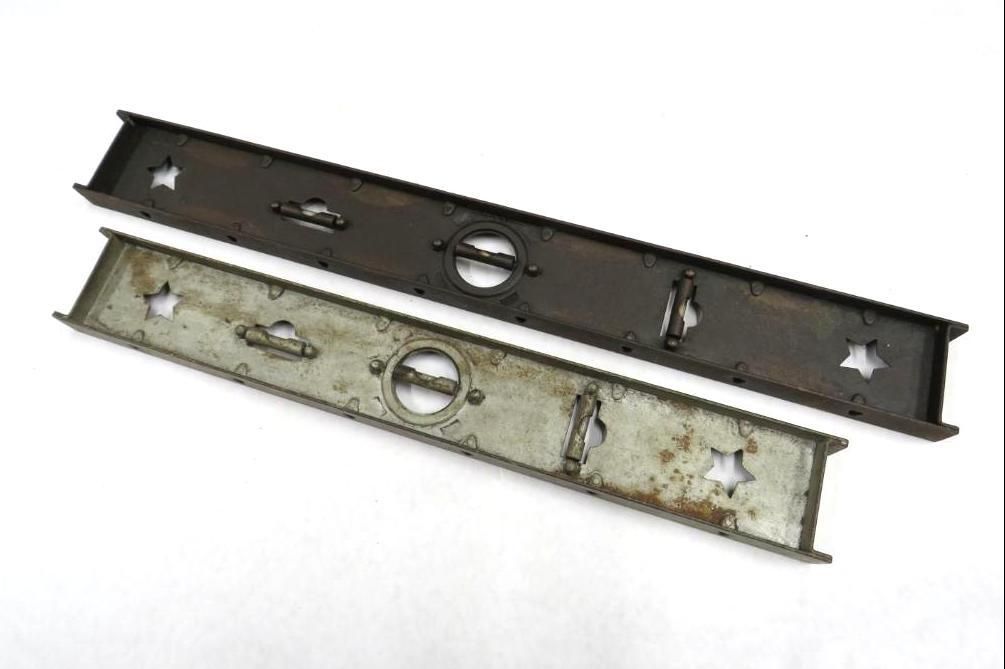 Two metal levels, one dark, one light, with central circle and star-shaped cutouts.