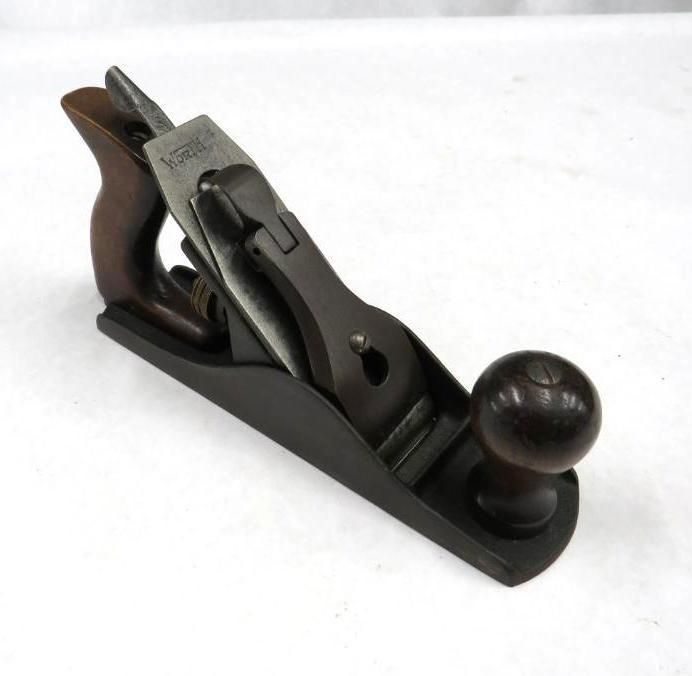 Hand plane tool with wooden handle and knob, black base.
