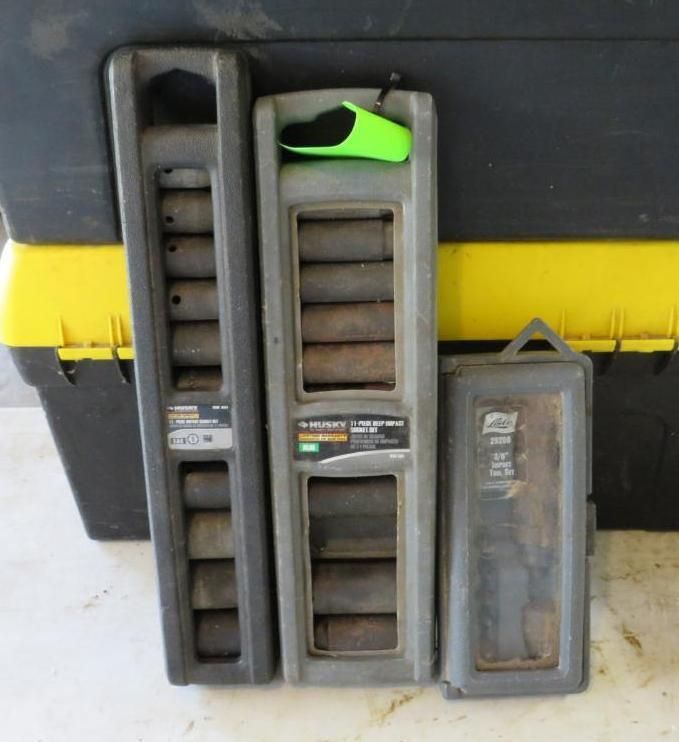 Three tool organizers of various sizes, with sockets.
