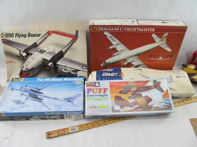 Model airplane boxes: C-119 Flying Boxcar, Douglas C-118 Liftmaster, TU-95 Bear Bomber, and Puff the Magic Dragon.