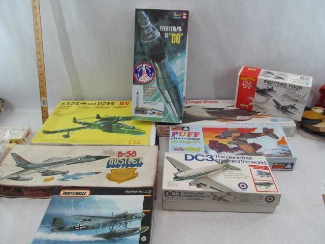 Several vintage model airplane boxes. Different sizes, colors, and designs, including