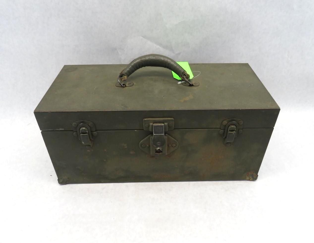 Green metal toolbox with leather handle and latches.