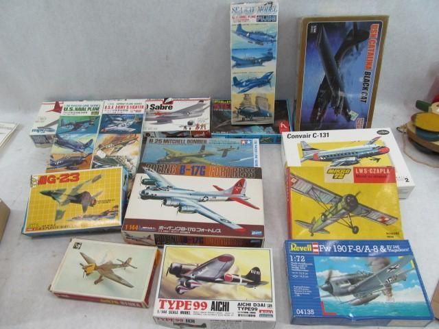 Collection of vintage model airplane boxes, with colorful illustrations.