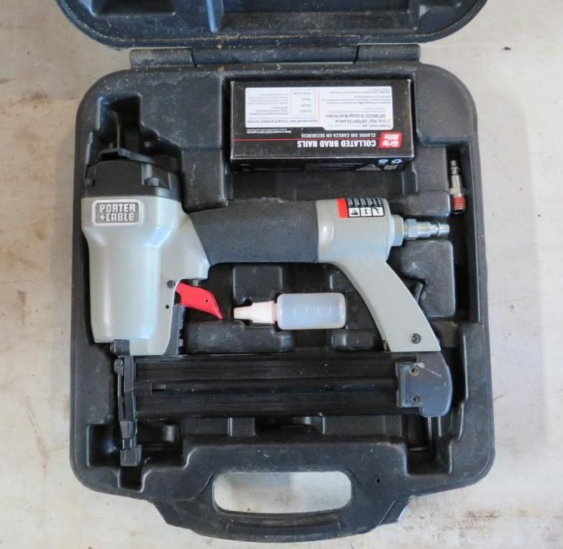 Gray and black Porter-Cable nail gun with accessories in a case.