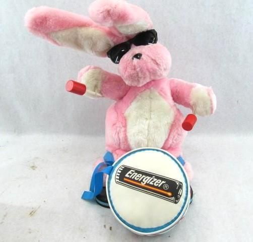 Pink bunny wearing sunglasses, playing a drum with Energizer logo.