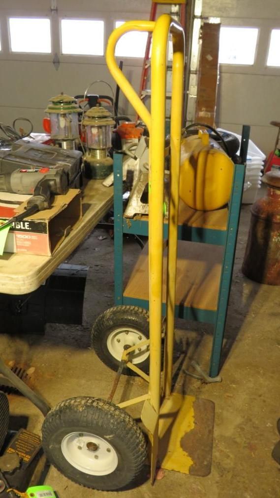 Yellow hand truck with black tires.