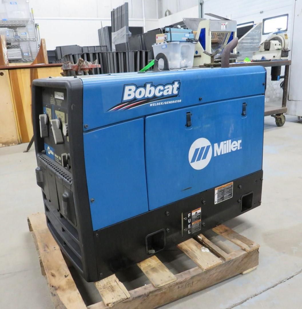 Blue and black Miller Bobcat welder generator on a wooden pallet.