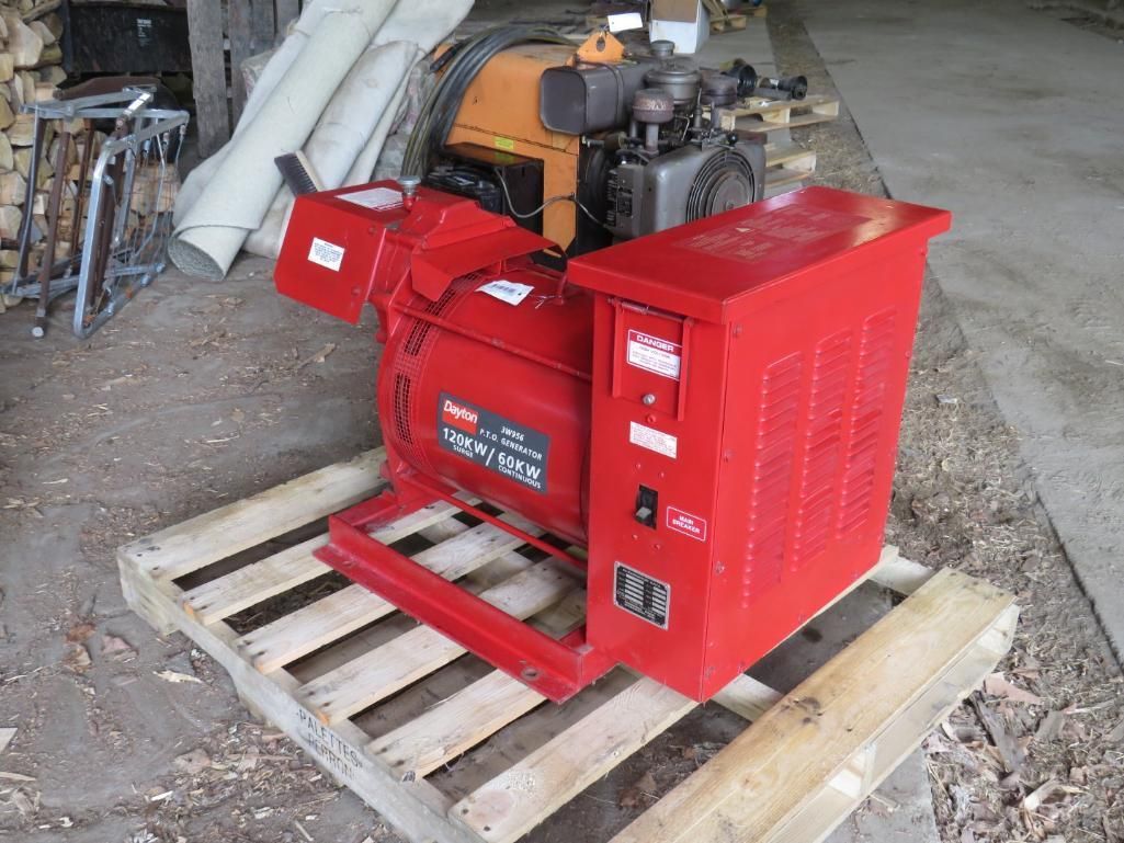 Red generator on wooden pallet.
