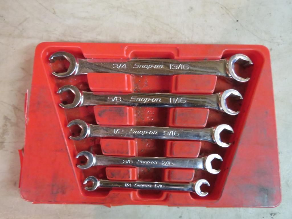 Set of Snap-on wrenches in a red plastic tray.