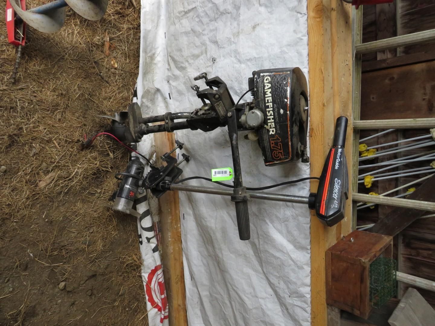 Outboard motor mounted on a wooden frame.