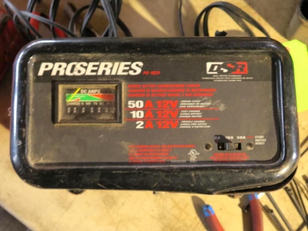 Black battery charger with a gauge and settings for different amperage levels.