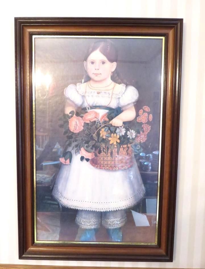 Painting of a girl in white dress holding flower basket, framed.