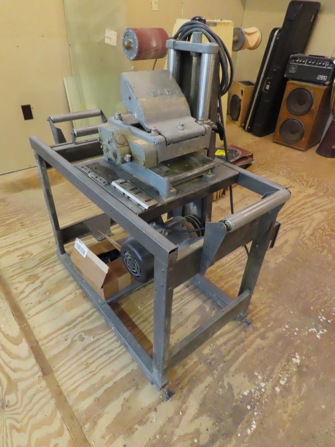 Industrial metal machine on a steel frame in a workshop