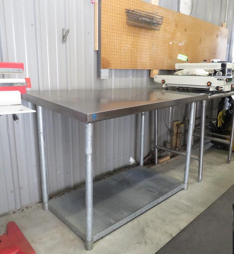Stainless steel work table in a workshop.