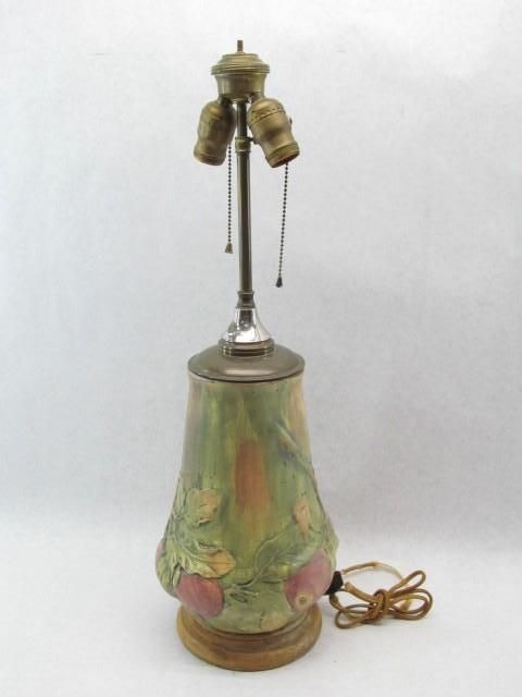Green and pink ceramic table lamp with three bulb sockets.