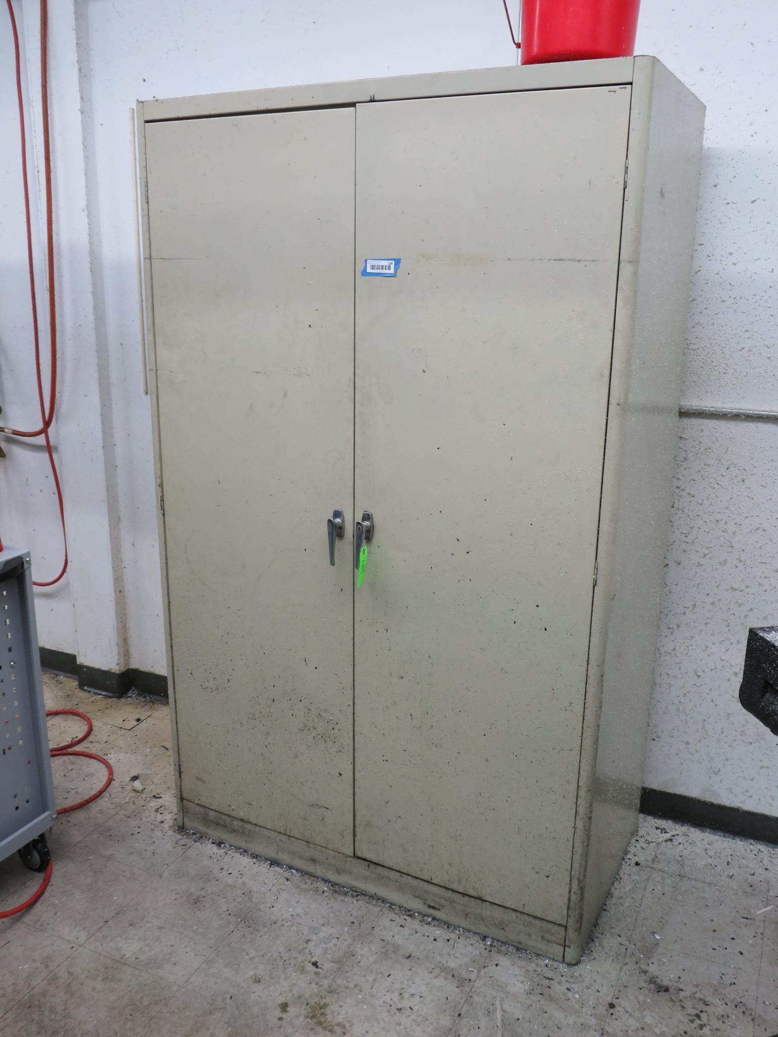 Tan metal storage cabinet with two doors, locks.