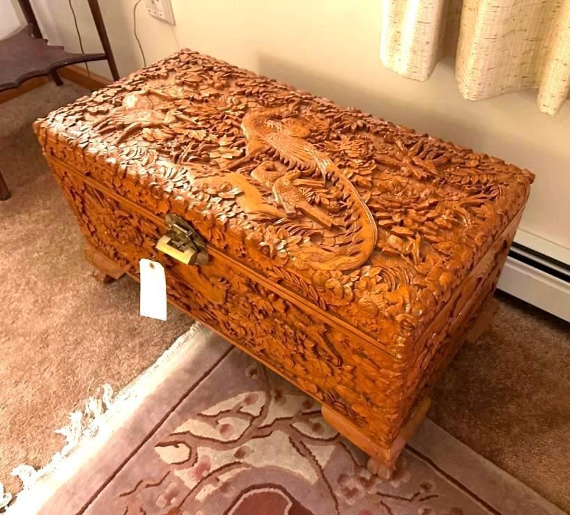 Ornate wooden chest with carved details.